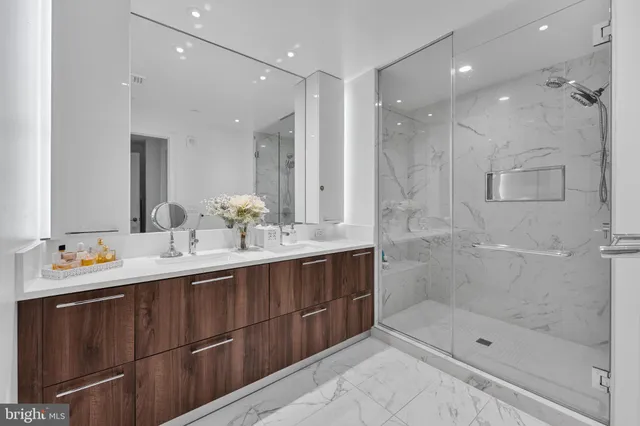 a white toilet sitting next to a bathroom sink