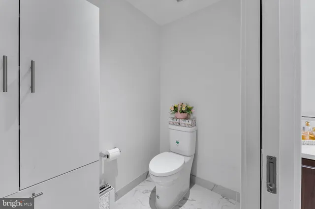 a bathroom with a shower sink and mirror