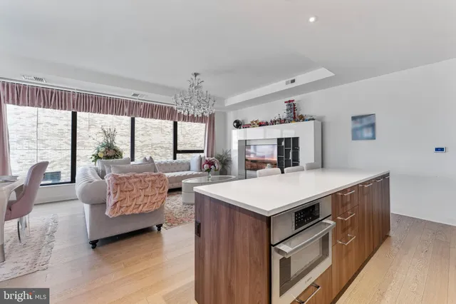 a living room with furniture fireplace and a flat screen tv