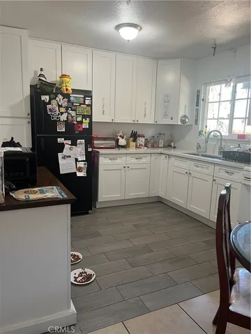 a view of a backyard with sitting area