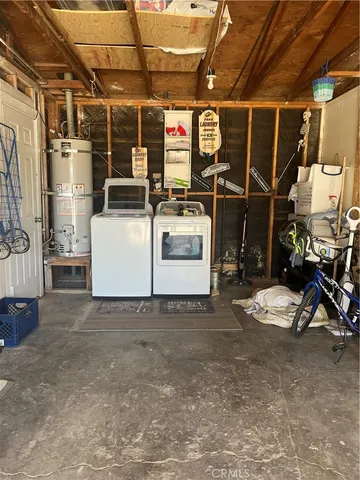 a kitchen with cabinets appliances a sink and a window