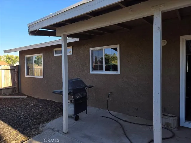 a kitchen with a sink and a stove next to a window