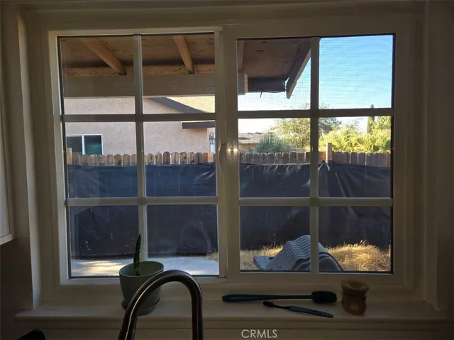 a view of a workspace with furniture and rug