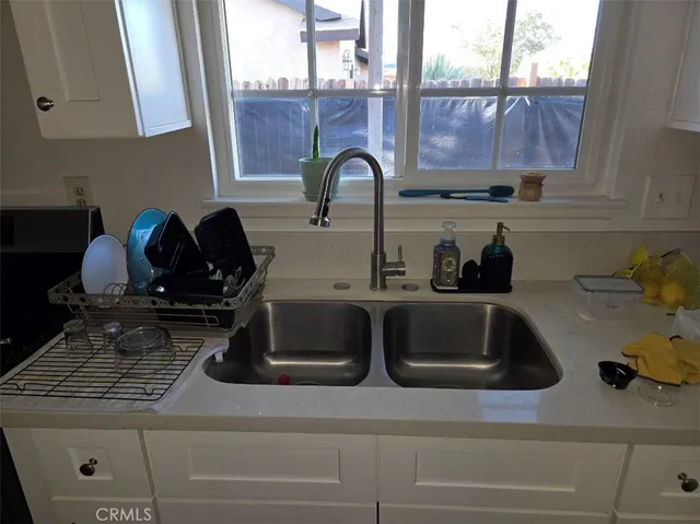 a bathroom with a shower and a sink