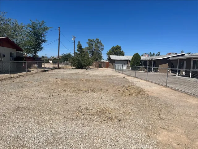 a swimming pool with outdoor seating and yard