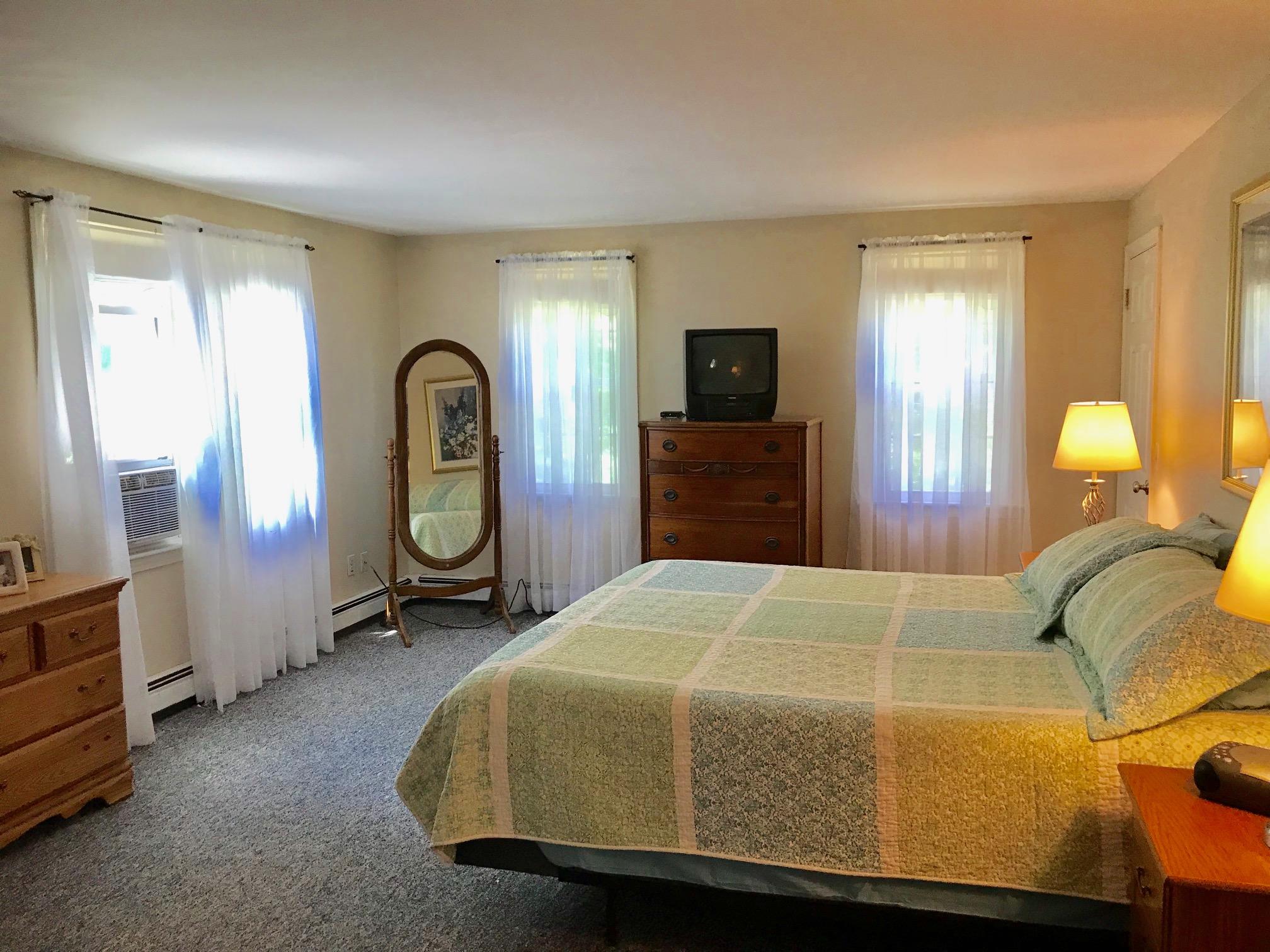 44 Pimlico Pond Road Forestdale, MA 02644 - Photo 13 of 28 a bedroom with a bed a dresser and mirror