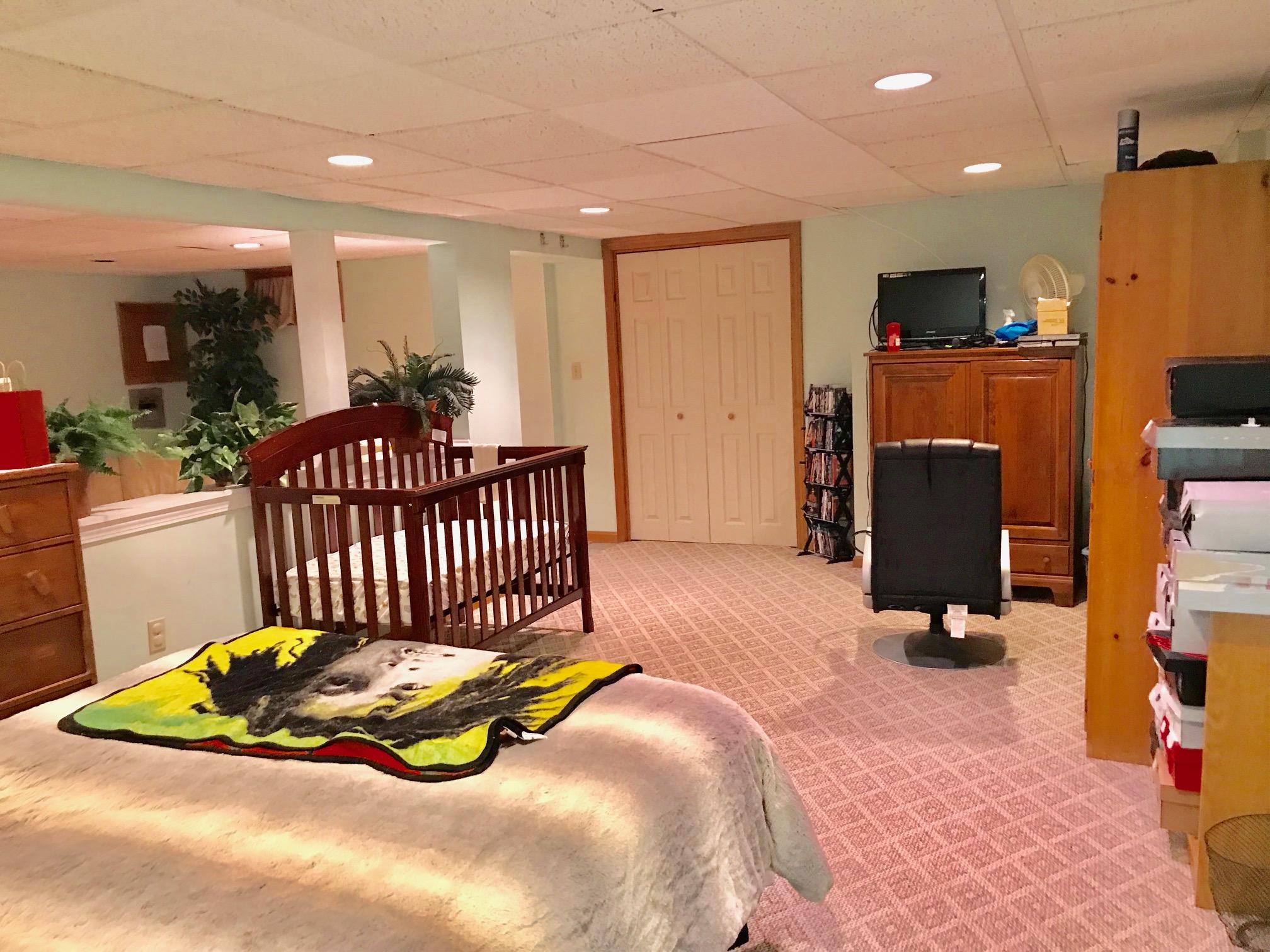 44 Pimlico Pond Road Forestdale, MA 02644 - Photo 21 of 28 a bedroom with a bed and wooden floor