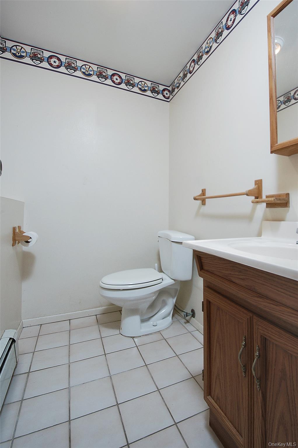 554 High Street Monroe, NY 10950 - Photo 29 of 29 a bathroom with a sink a toilet and a mirror