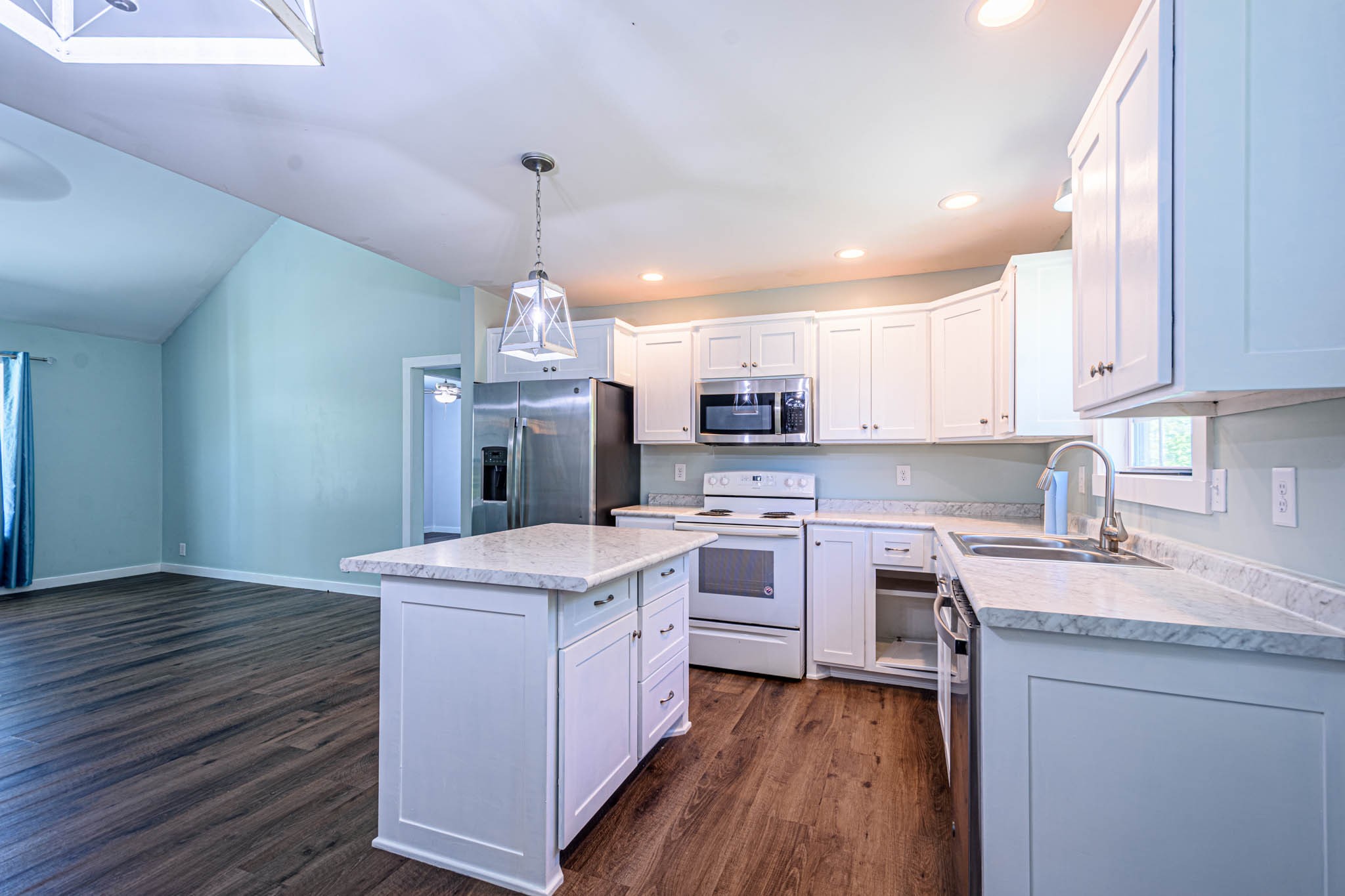 493 Powell Chapel Road Pulaski, TN 38478 - Photo 6 of 35 a kitchen with a stove a sink and a refrigerator