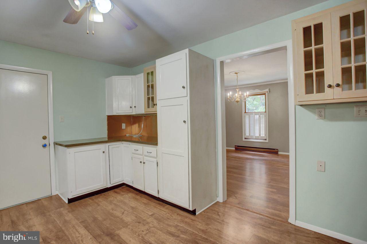 721 Narrows Road Biglerville, PA 17307 - Photo 13 of 40 a hallway with cabinets and wooden floor