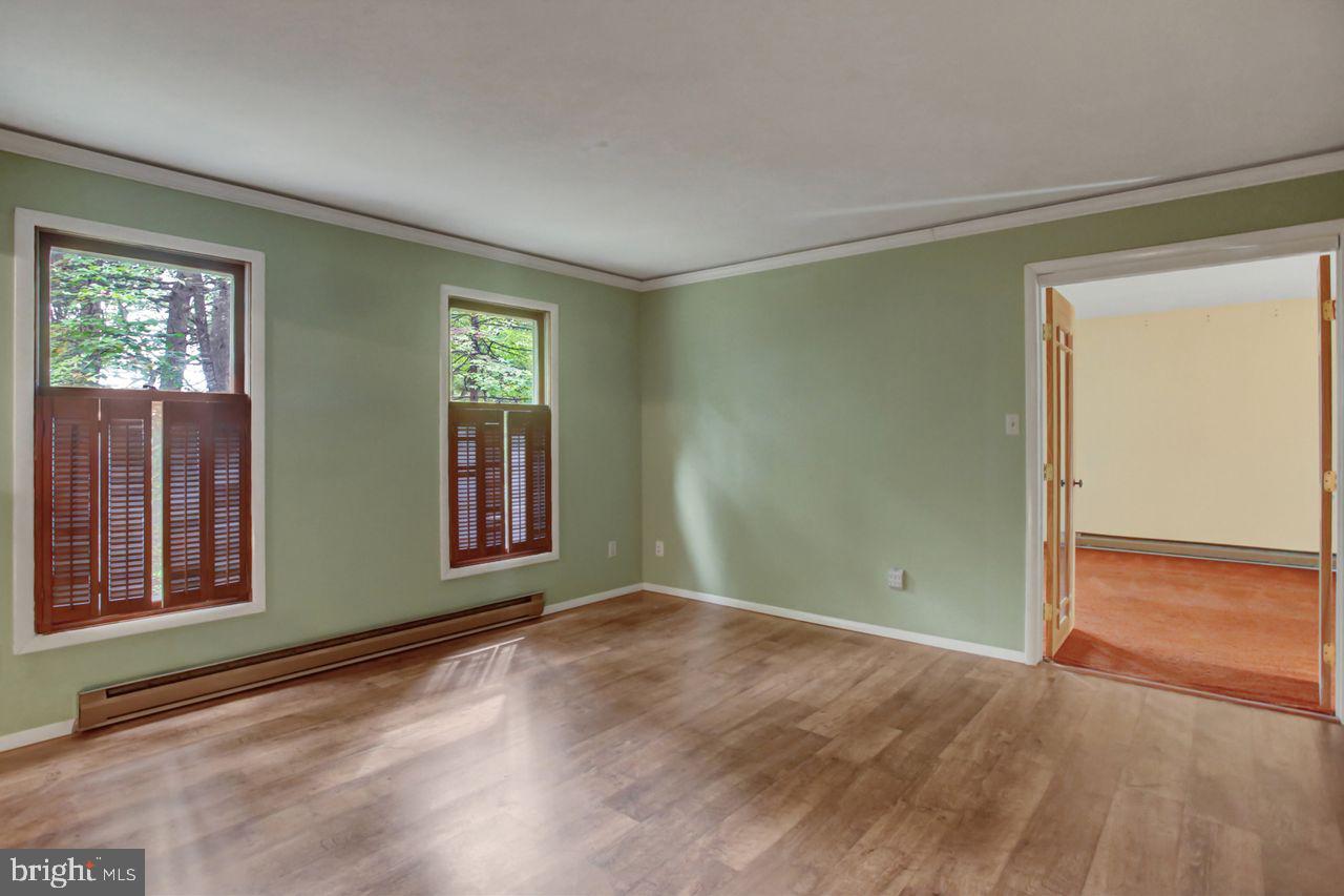 721 Narrows Road Biglerville, PA 17307 - Photo 15 of 40 an empty room with wooden floor and windows