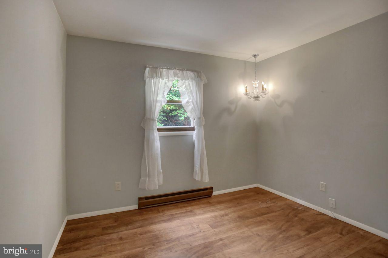 721 Narrows Road Biglerville, PA 17307 - Photo 21 of 40 a view of empty room with wooden floor and fan