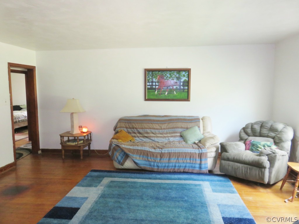 7512 Hopkins Road North Chesterfield, VA 23237 - Photo 3 of 13 a bedroom with furniture and a wooden floor