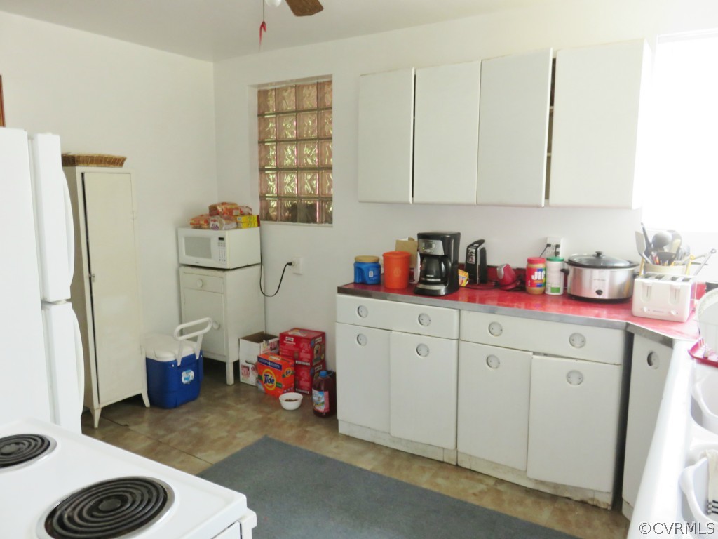 7512 Hopkins Road North Chesterfield, VA 23237 - Photo 8 of 13 a kitchen with a refrigerator and a sink