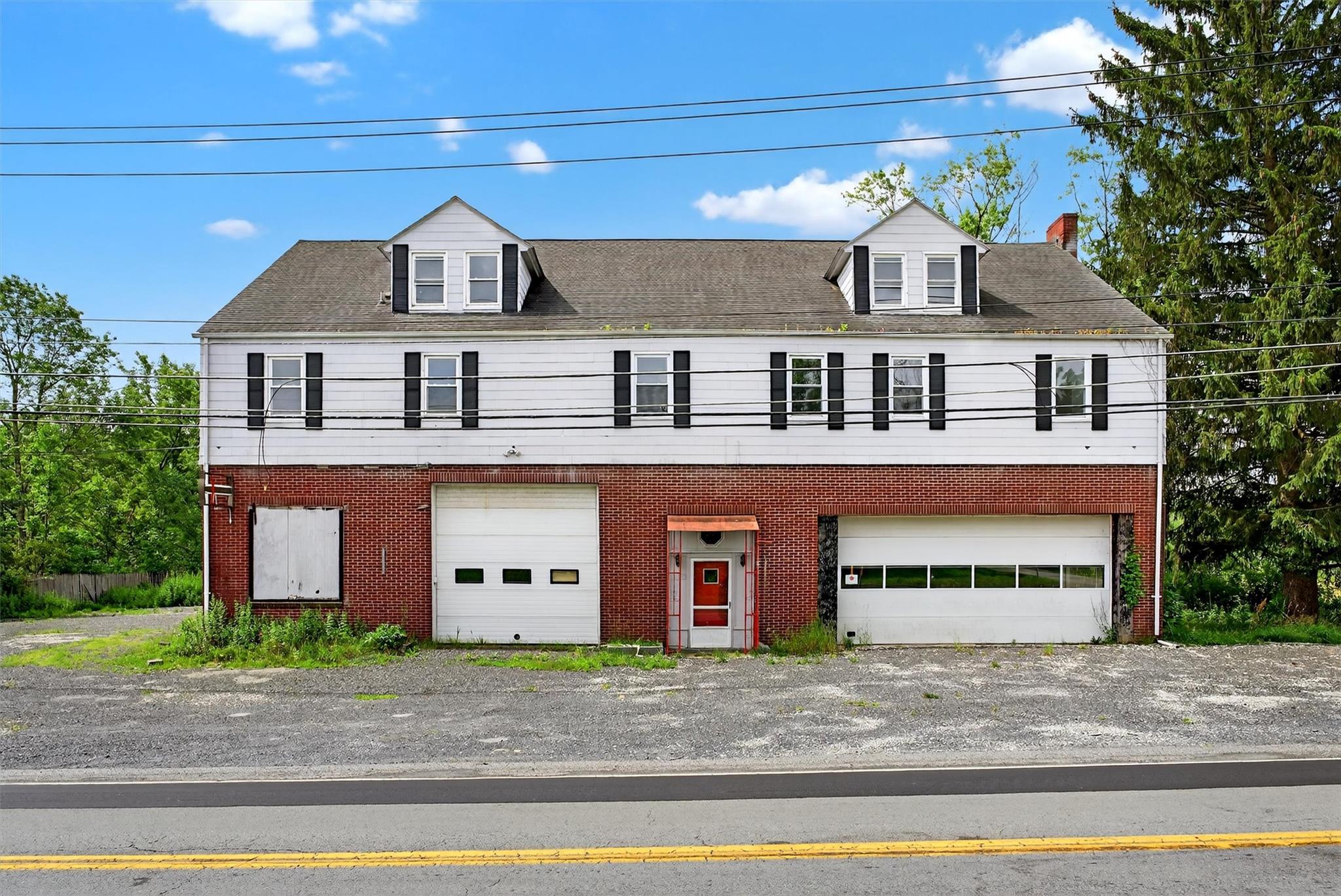 2213 Mt Hope Road Middletown, NY 10940 - Photo 1 of 1 View of front of house with a balcony, a garage, brick siding, and driveway