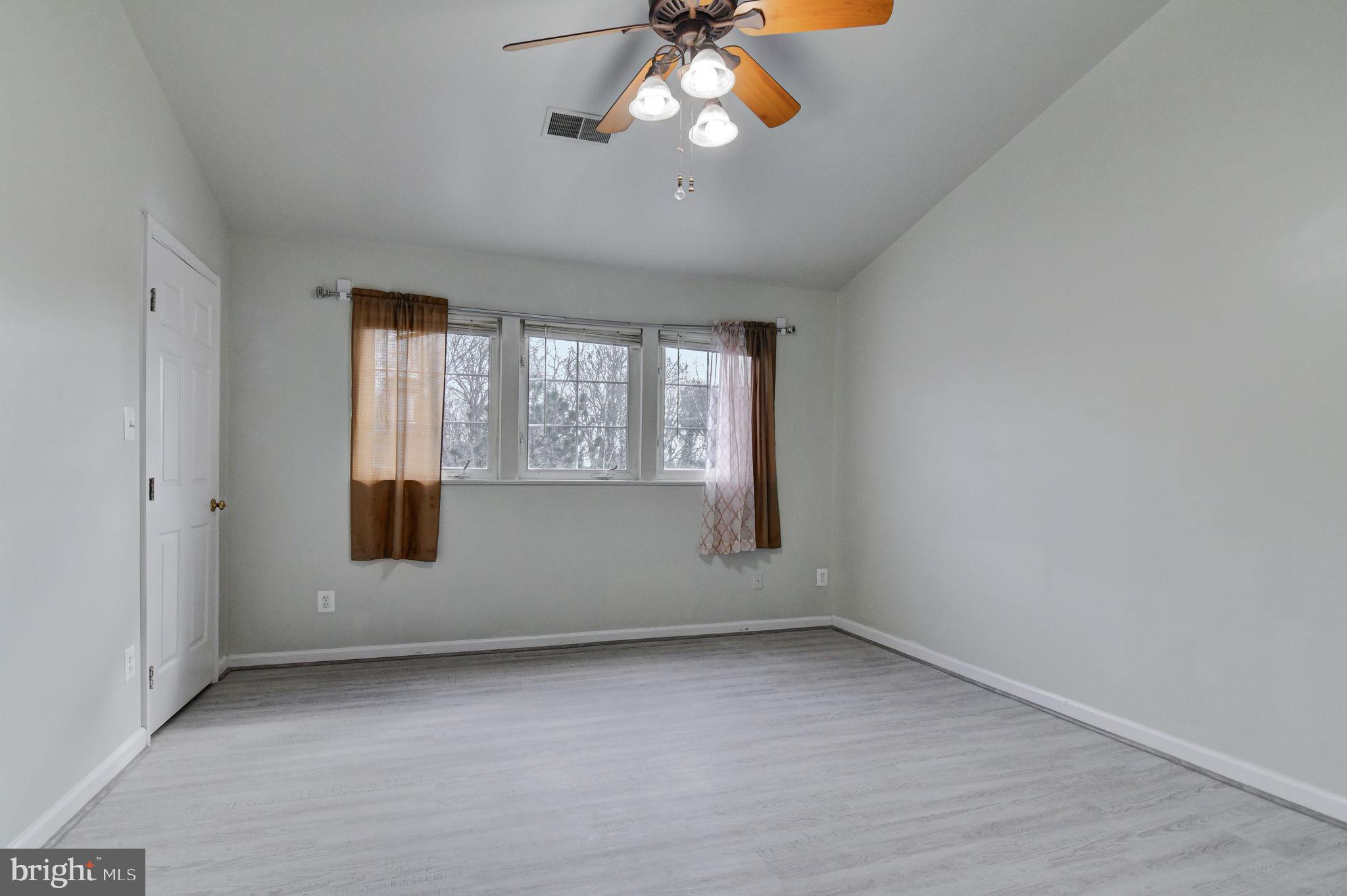 4013 Mammoth Cave Loop Dumfries, VA 22025 - Photo 16 of 38 a view of an empty room with a window
