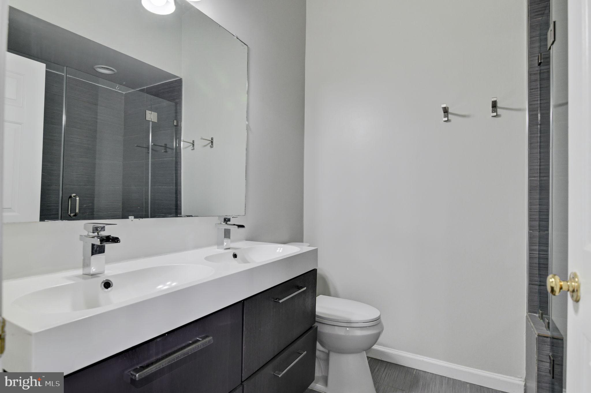 4013 Mammoth Cave Loop Dumfries, VA 22025 - Photo 18 of 38 a bathroom with a sink and a mirror