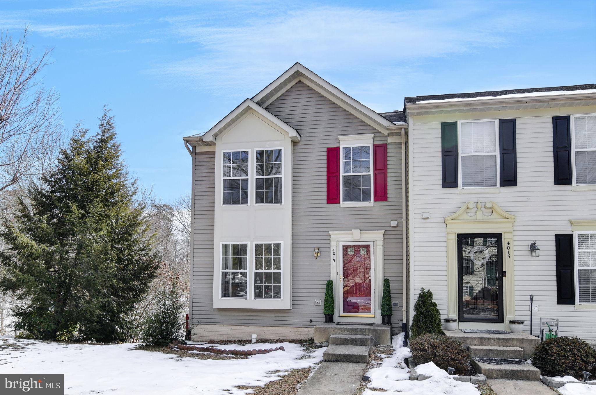 4013 Mammoth Cave Loop Dumfries, VA 22025 - Photo 2 of 38 a front view of a house with a yard