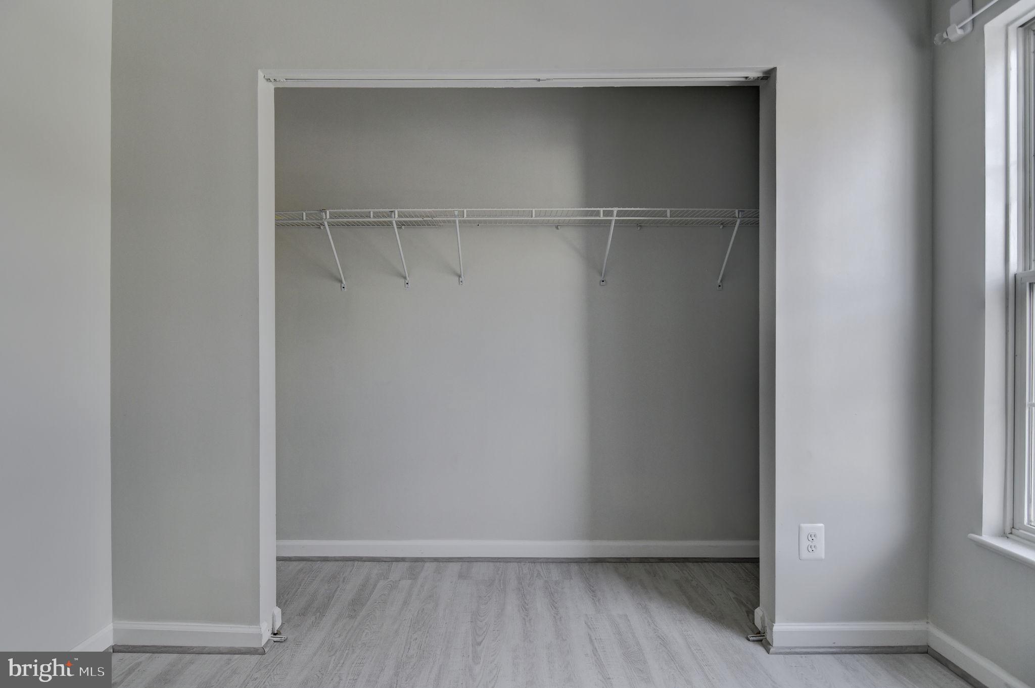 4013 Mammoth Cave Loop Dumfries, VA 22025 - Photo 23 of 38 a view of an empty walk in closet with empty racks