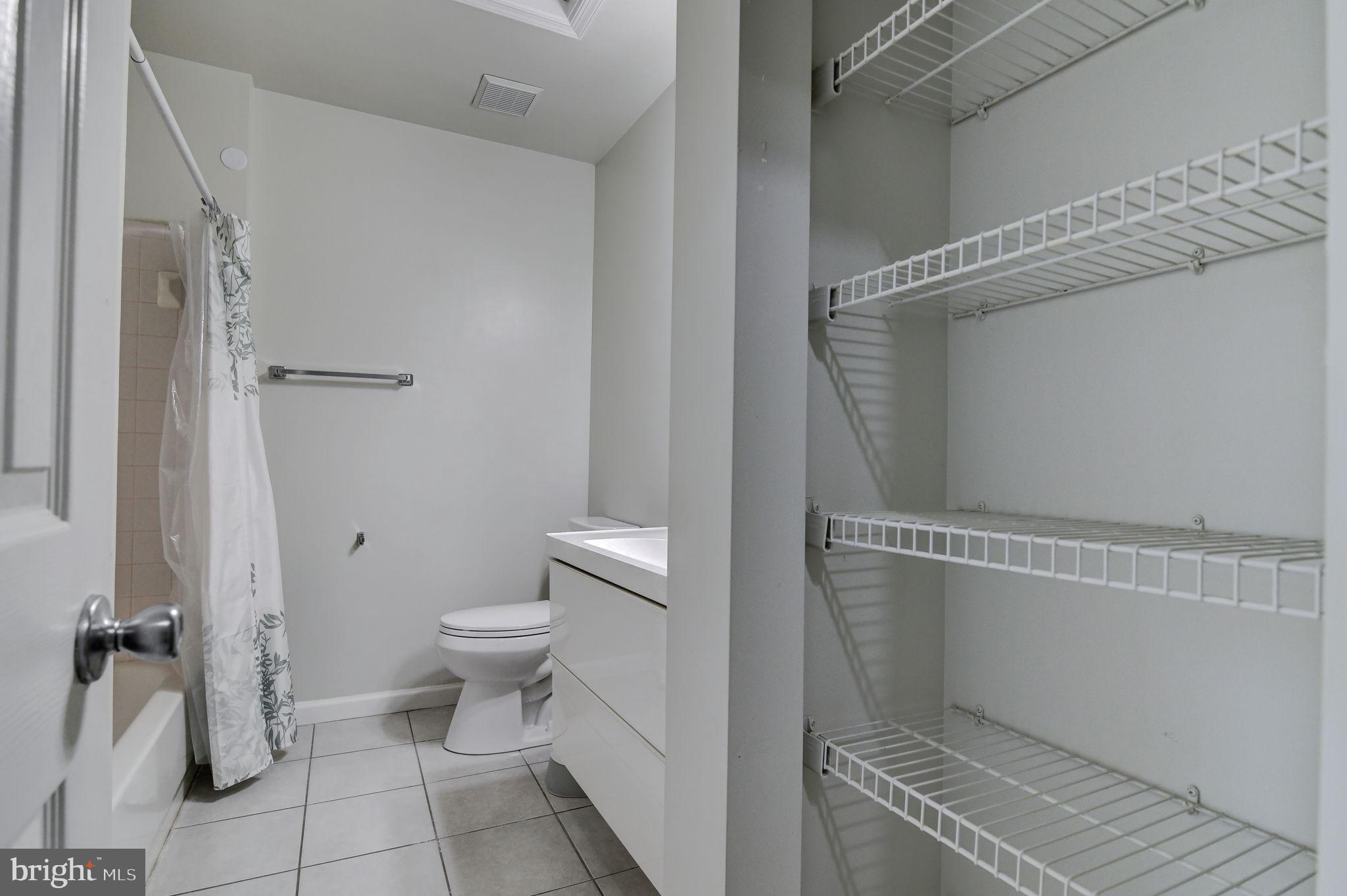4013 Mammoth Cave Loop Dumfries, VA 22025 - Photo 26 of 38 a bathroom with a toilet and a shower