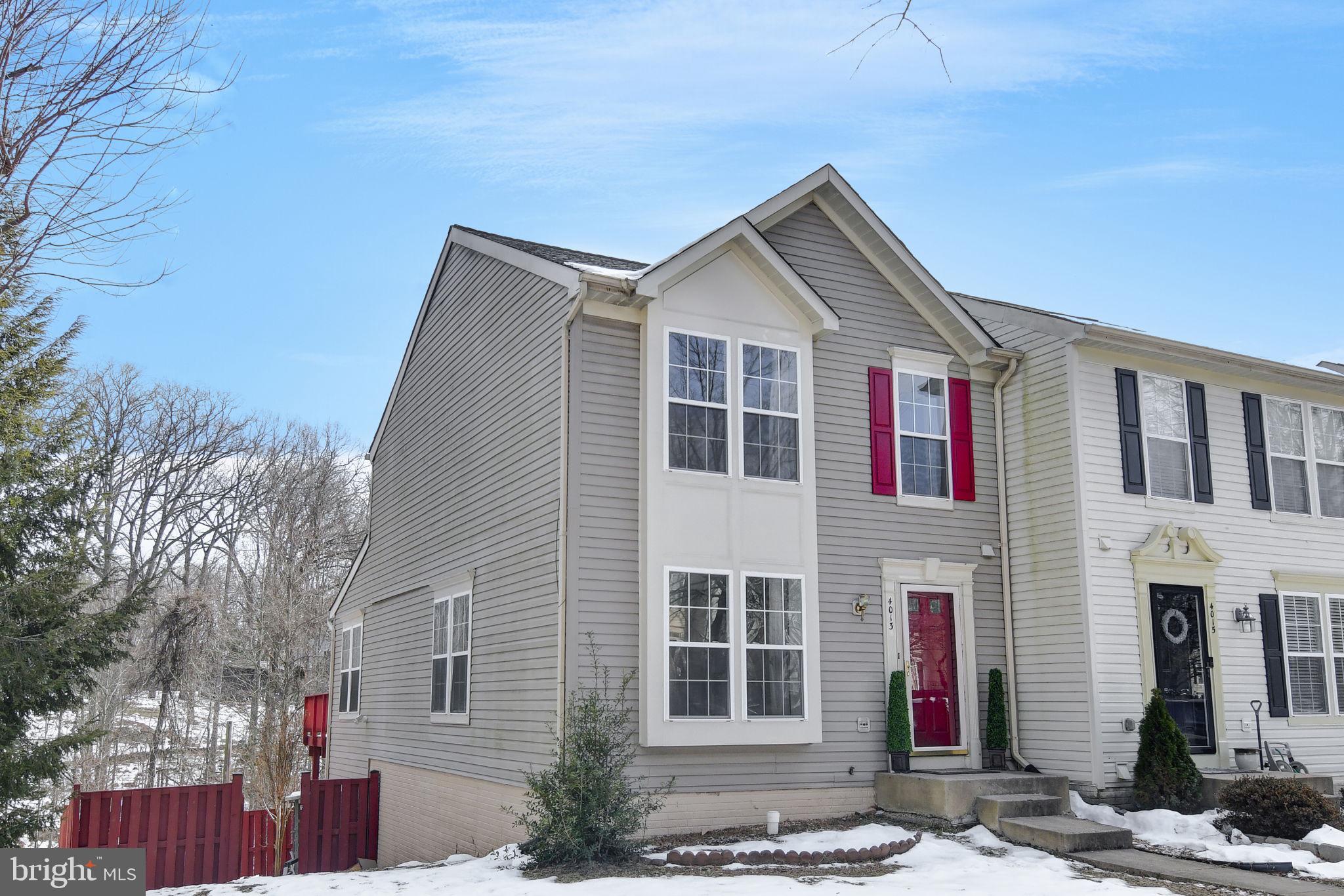 4013 Mammoth Cave Loop Dumfries, VA 22025 - Photo 3 of 38 a front view of a house with a yard