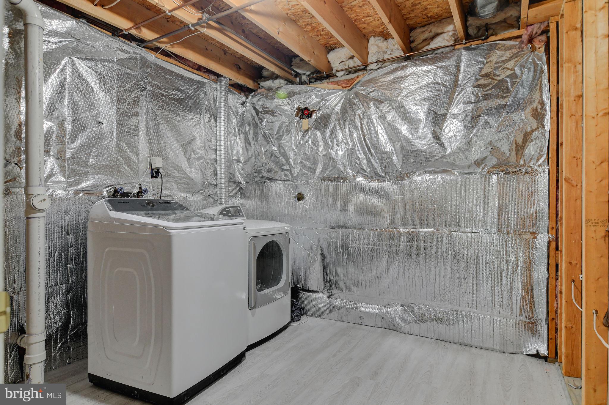 4013 Mammoth Cave Loop Dumfries, VA 22025 - Photo 35 of 38 a utility room with dryer and washer