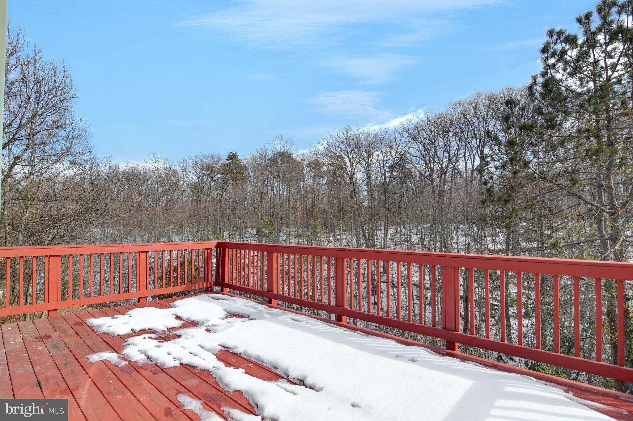 4013 Mammoth Cave Loop Dumfries, VA 22025 - Photo 37 of 38 a view of a roof with wooden fence