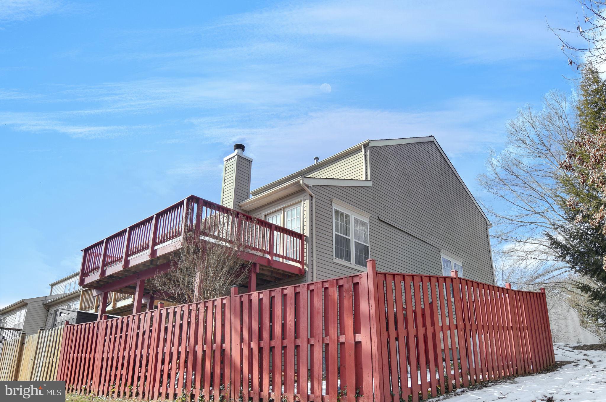 4013 Mammoth Cave Loop Dumfries, VA 22025 - Photo 38 of 38 a view of balcony with wooden floor and fence