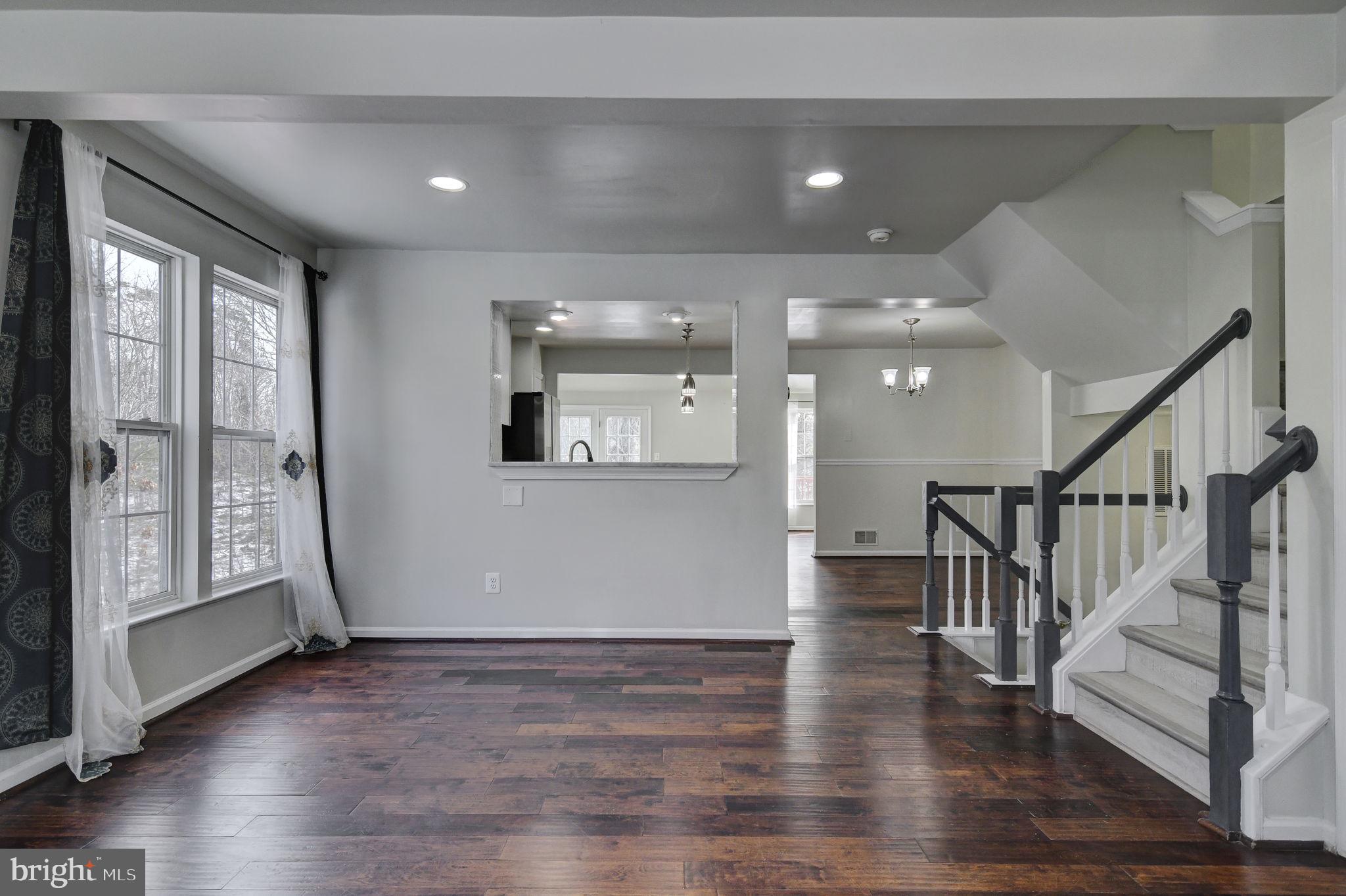 4013 Mammoth Cave Loop Dumfries, VA 22025 - Photo 7 of 38 a view of empty room with wooden floor and fan