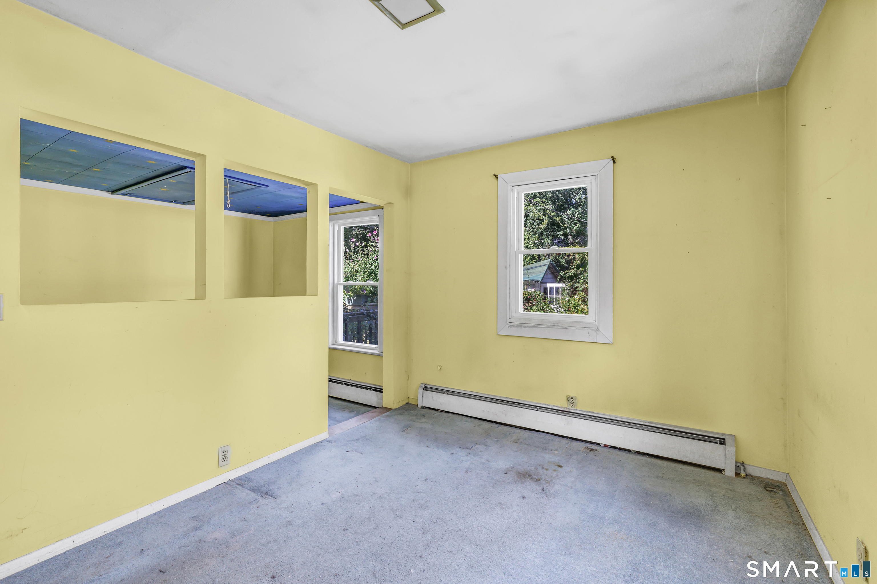 606 North Madison Road Guilford, CT 06437 - Photo 18 of 38 Bedroom with multiple windows and natural light, ready for your finishing touches.