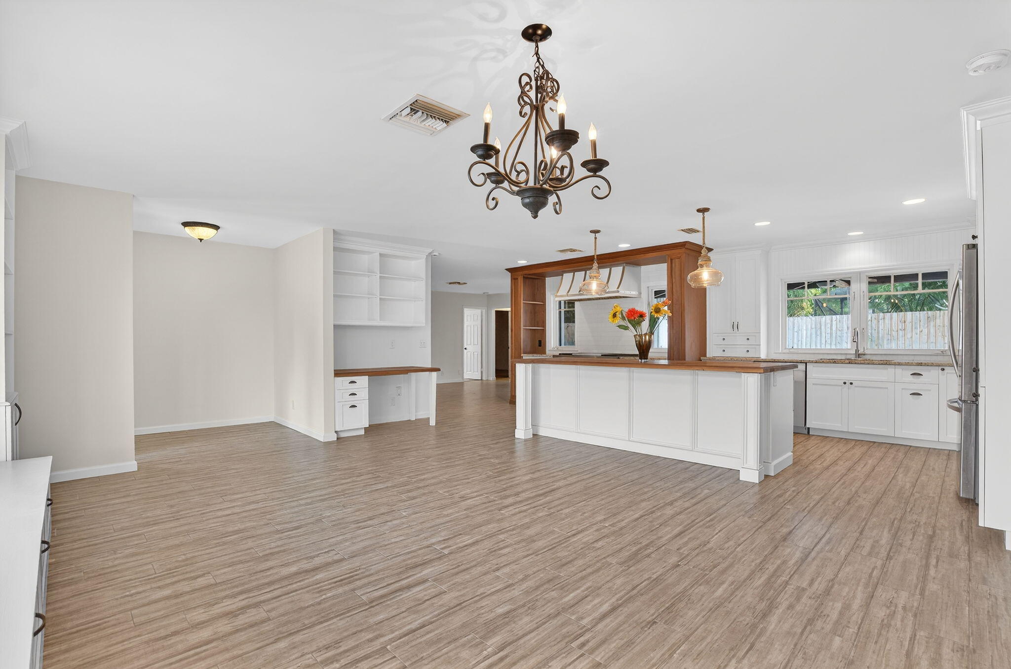 28 Hickory Hill Road Tequesta, FL 33469 - Photo 23 of 30 28 HH LARGE SHOT FAM RM WINDOW ENTIRE KI