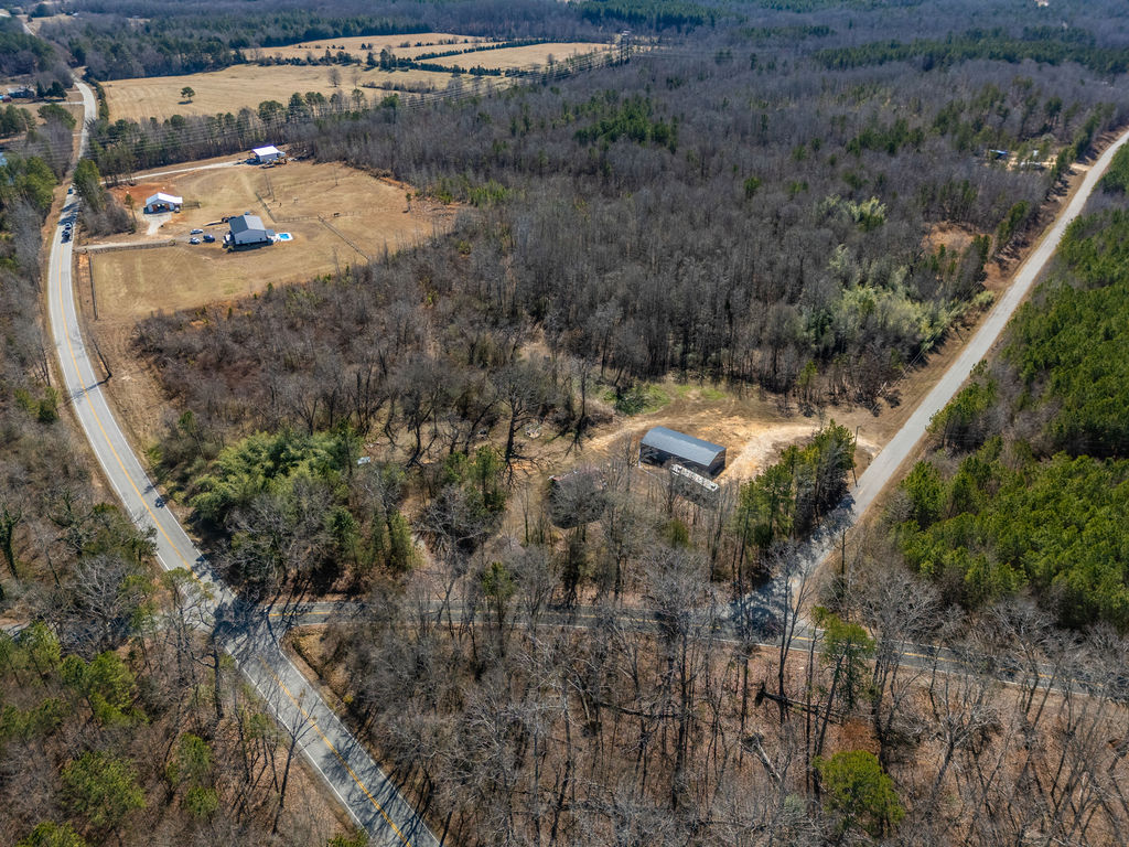 900 Asaville School Road Anderson, SC 29621 - Photo 16 of 29 This elevated perspective captures expansive grounds featuring multiple residences and ample green spaces.