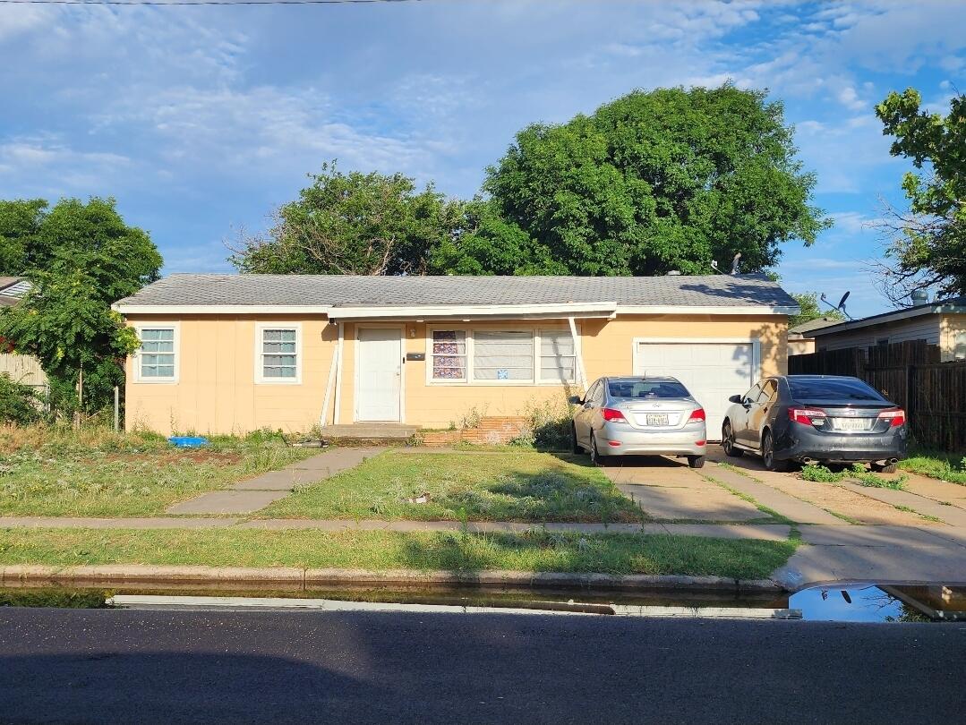6120 Avenue R Lubbock, TX 79412 - Photo 1 of 1 a view of a house with a patio and a yard