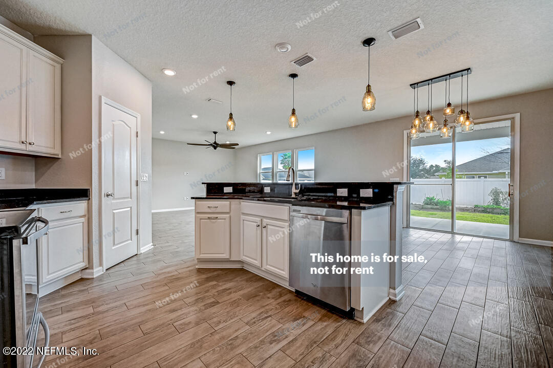 68 Redland Way Jacksonville, FL 32218 - Photo 12 of 36 a kitchen with counter top space and appliances