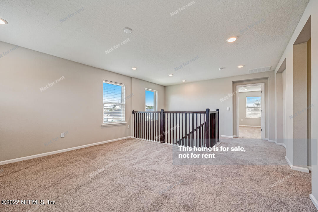 68 Redland Way Jacksonville, FL 32218 - Photo 15 of 36 a view of a hallway with a bedroom and entryway
