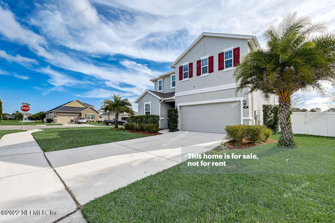 68 Redland Way Jacksonville, FL 32218 - Photo 2 of 36 a front view of a house with garden