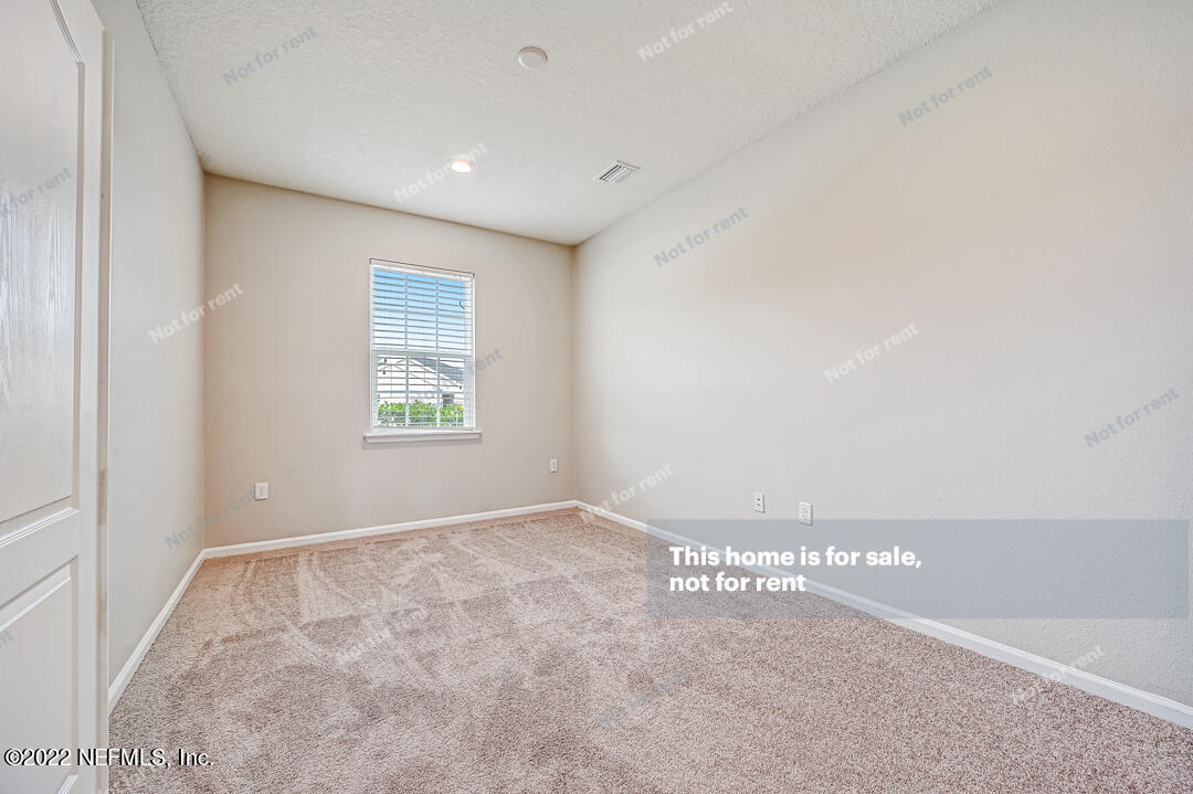 68 Redland Way Jacksonville, FL 32218 - Photo 22 of 36 a view of an empty room with a window
