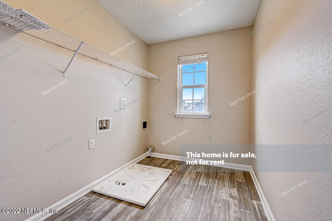 68 Redland Way Jacksonville, FL 32218 - Photo 27 of 36 a view of a room with wooden floor and windows