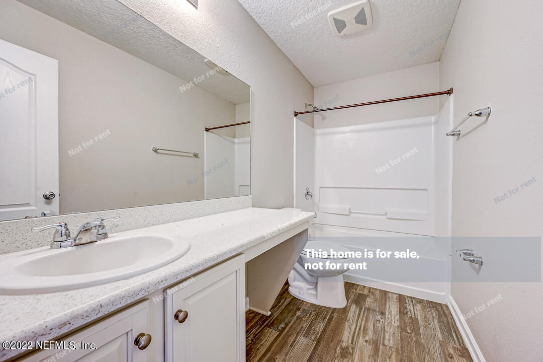 68 Redland Way Jacksonville, FL 32218 - Photo 30 of 36 a bathroom with a sink and a mirror