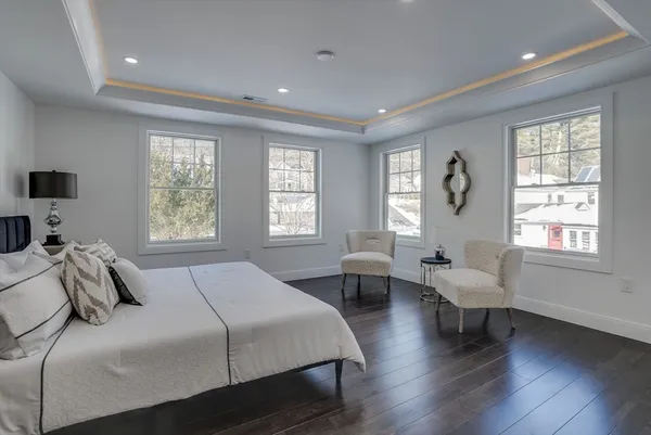 a bedroom with a bed and a couch