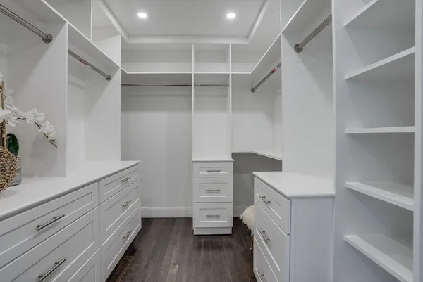 a view of cabinets and wooden floor