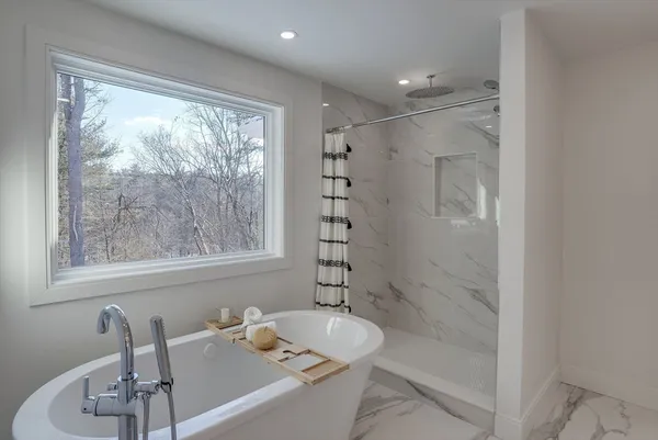 a bathroom with a bathtub and sink