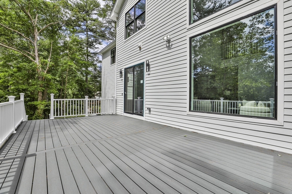 709 Main Street Acton, MA 01720 - Photo 3 of 42 a view of a wooden deck with a yard
