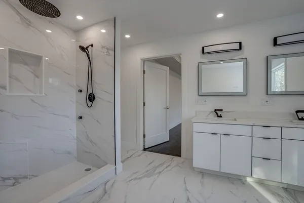 a bathroom with a shower and a sink