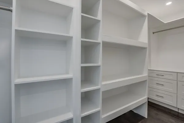 a view of an empty walk in closet