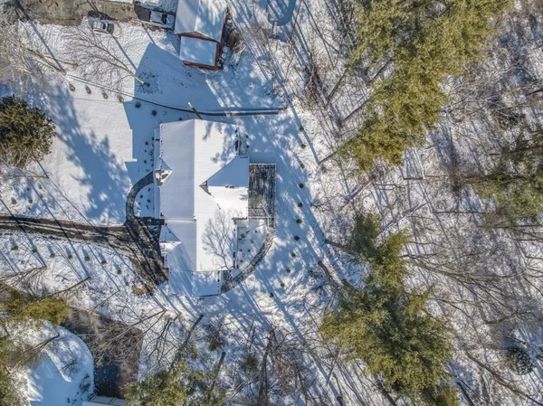 a aerial view of a house with a yard