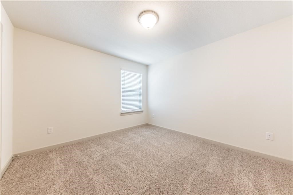 8304 Mimi Lane Austin, TX 78724 - Photo 11 of 32 an empty room with a empty space and a window