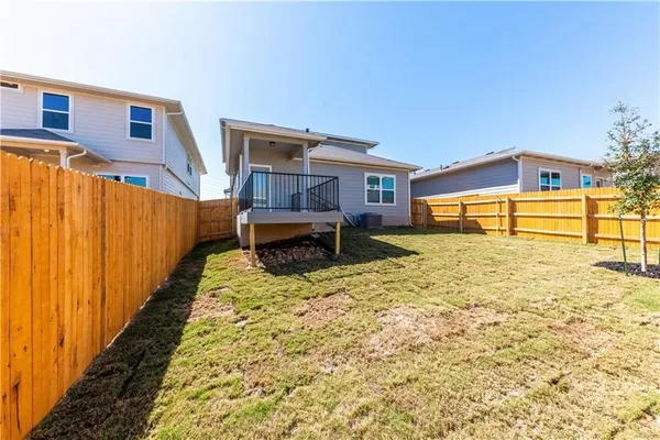 a view of a porch with wooden floor and furniture