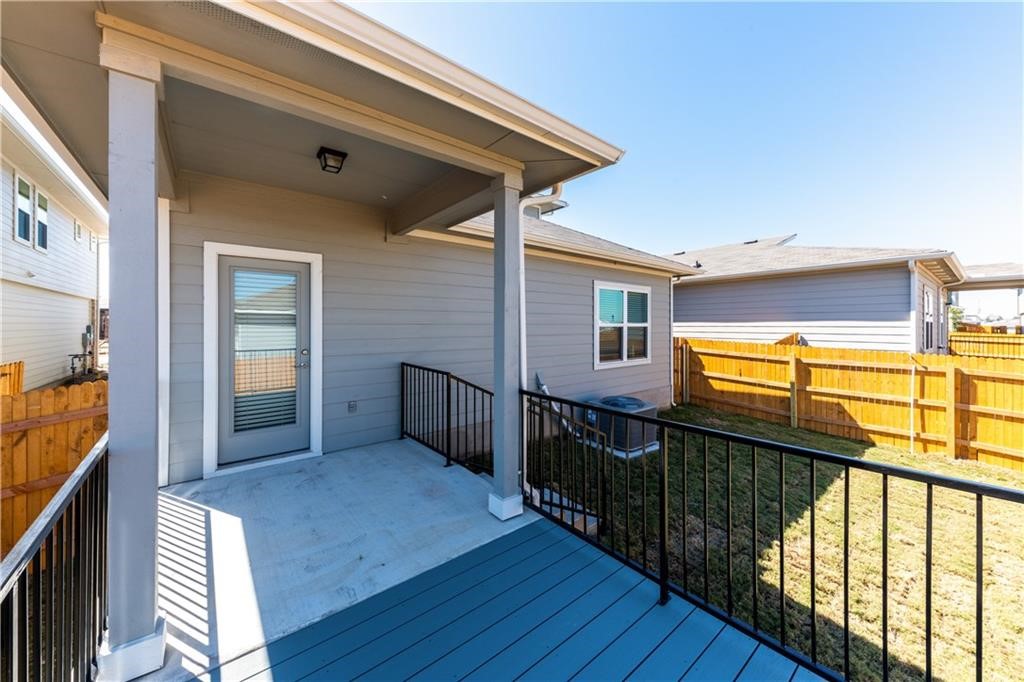 8304 Mimi Lane Austin, TX 78724 - Photo 22 of 32 a view of a porch with wooden floor and furniture