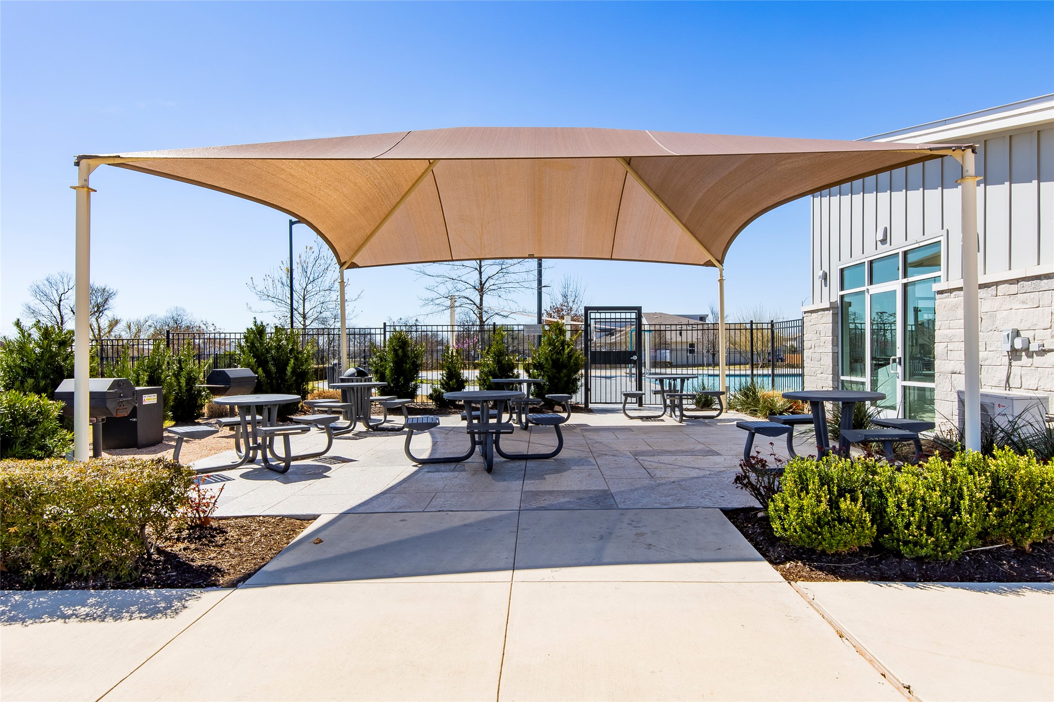 8304 Mimi Lane Austin, TX 78724 - Photo 29 of 32 a view of patio with couches table and chairs under an umbrella